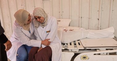 A Palestinian health worker mourns the death of a family member in an Israeli strike, Jabalia, northern Gaza, Palestine, April 23, 2025. (AA Photo)