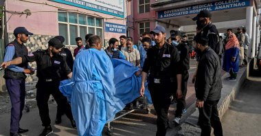 Paramedics and police personnel carry an injured tourist at a hospital in Anantnag, south of Srinagar, Indian-administered Kashmir, April 22, 2025. (AFP Photo)