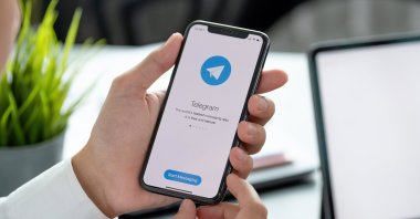 A person holds a phone with the Telegram app open in this undated file photo. (Shutterstock File Photo)