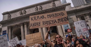 A person holds a sign with the names of Kilmar, Mahmoud, Andry, Rümeysa and Mohsen as people take part in a protest organized to “Protect Migrants, Protect the Planet,” New York, U.S., April 19, 2025. (AFP Photo)