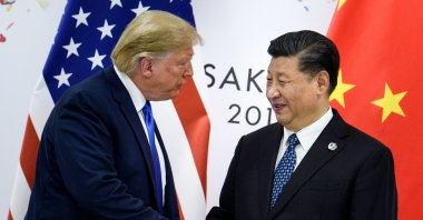 This file photo shows China&#039;s President Xi Jinping (R) shaking hands with U.S. President Donald Trump before a bilateral meeting on the sidelines of the G-20 summit, Osaka, Japan, June 28, 2019. (AFP Photo)