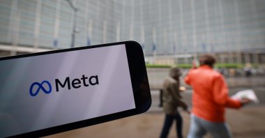 A Meta company logo on a phone in front of European Commission headquarters, Brussels, Belgium, April 23, 2025. (EPA Photo)