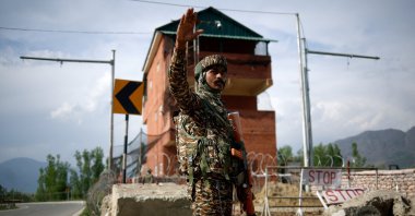 A member of Indian security personnel stands guard on a highway leading to South Kashmir's Pahalgam, following a suspected militant attack, in Marhama village, in Kashmir, April 23, 2025. REUTERS/Adnan Abidi