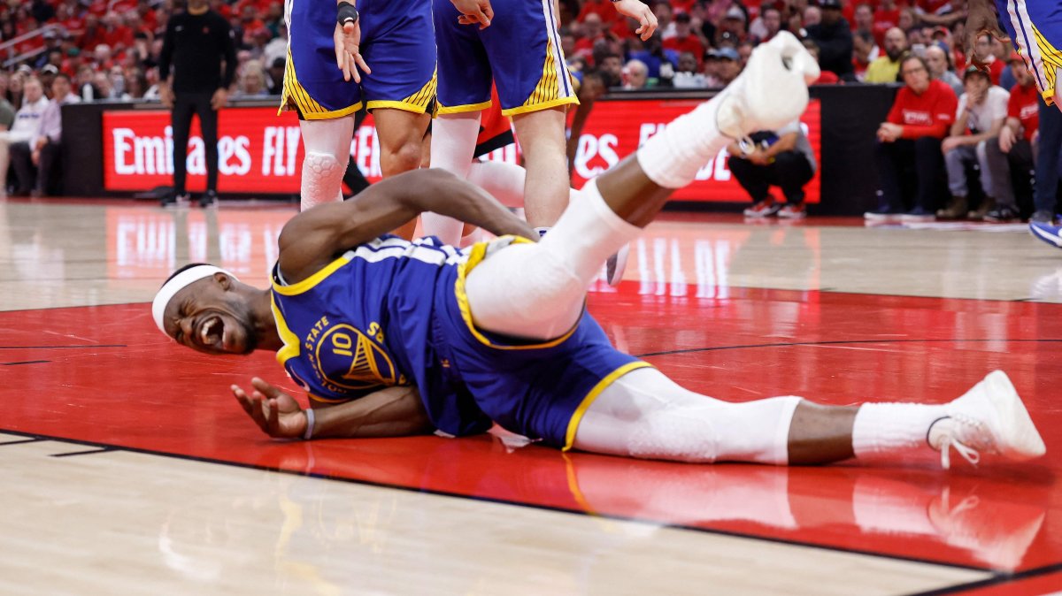 Golden State Warriors' Jimmy Butler III goes to the floor after being fouled by Houston Rockets' Amen Thompson in the first half in Game Two of the Western Conference First Round NBA Playoffs at Toyota Center, Houston, U.S., April 23, 2025. (AFP Photo)