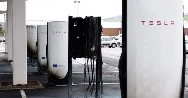 A photo shows damaged and destroyed Tesla charging stations, burnt on the day of a so-called &quot;Tesla Takedown&quot; call for a global day of action against U.S. electric carmaker Tesla, in Saint-Chamond, central France, March 29, 2025. (AFP Photo)
