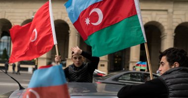 People carrying Turkish and Azerbaijani flags celebrate in the streets of Baku, Azerbaijan, Aug. 11, 2020. (Shutterstock Photo)