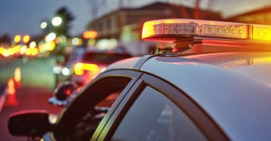A police car flashes its lights alongside a road, U.S., July 11, 2024. (Getty Images Photo)