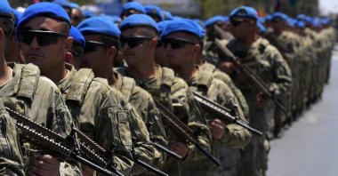 Turkish soldiers participate in a military parade to commemorate the anniversary of the 1974 Peace Operation in Lefkoşa (Nicosia), Turkish Cyprus, on July 20, 2024. (AP Photo)