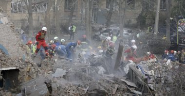 Rescuers work at the site of a residential building hit by a rocket in Kyiv, Ukraine, April 24, 2025. (EPA Photo)