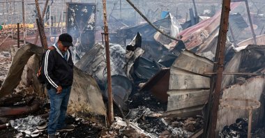 Palestinian farmer Ahmad Khalil reacts as he stands amid the charred remains of his agricultural installation, following an attack by Israeli settlers in the village of Sinjil, north of the occupied West Bank, Ramallah, Palestine, April 23, 2025. (AFP Photo)