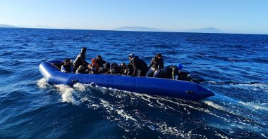 A group of migrants attempting to cross into Greece is caught on a rubber boat off the coast of western Izmir province, Türkiye, April 14, 2025. (AA Photo)
