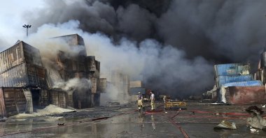 Firefighters work to extinguish the fire, Sunday, April 27, 2025, after a massive explosion and fire rocked a port near the southern port city of Bandar Abbas, Iran on Saturday. (AP Photo/Meysam Mirzadeh/Tasnim News)