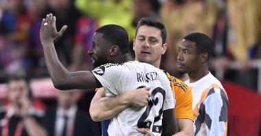 Real Madrid defender Antonio Rudiger is restrained as he shouts at the referee during the Copa del Rey final against Barcelona, Seville, Spain, April 26, 2025. (AA Photo)