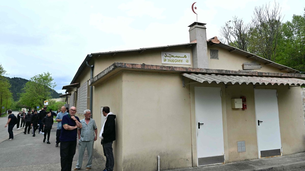 People stand outside a mosque in La Grand-Combe, southern France, April 27, 2025. (AFP Photo)