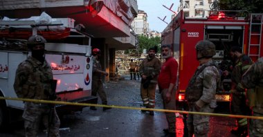Emergency personnel work at the site of an Israeli strike, southern suburbs of Beirut, Lebanon, April 27, 2025. (Reuters Photo)