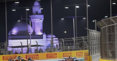 Ferrari driver Lewis Hamilton of Britain steers his car followed by McLaren driver Lando Norris of Britain during the Formula One Saudi Arabian Grand Prix at the Jeddah Corniche Circuit, Jeddah, Saudi Arabia, April 20, 2025. (AP Photo)