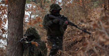 North Korean troops take part in a training exercise at an undisclosed location in North Korea, April 4, 2025. (AFP Photo)