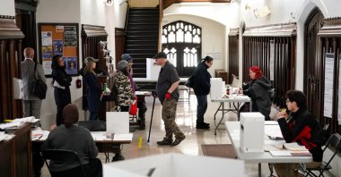 Elections Canada staff assist voters inside a polling station during Canada&#039;s federal election, in Toronto, Ontario, Canada April 28, 2025. (Reuters Photo)
 