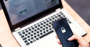Phone password lock and passcode safeguard data privacy from cyber threats on mobile and laptop devices. (Shutterstock Photo) 