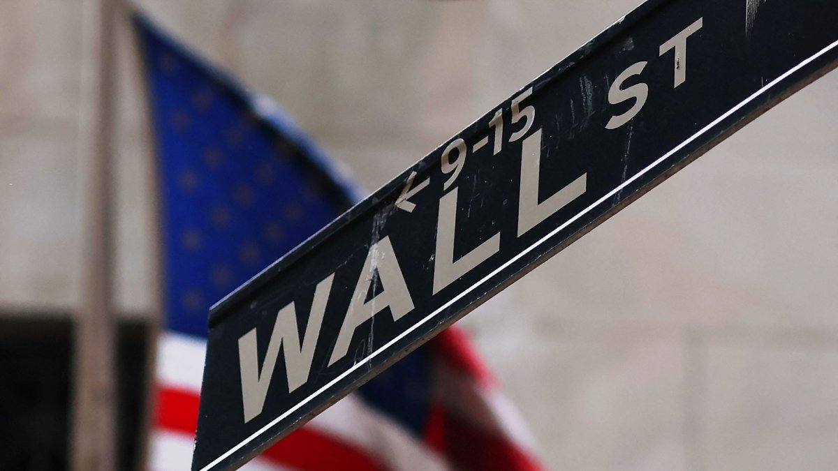 The Wall Street sign is seen outside of the New York Stock Exchange during morning trading, New York City, U.S., April 11, 2025. (AFP Photo)