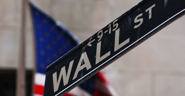 The Wall Street sign is seen outside of the New York Stock Exchange during morning trading, New York City, U.S., April 11, 2025. (AFP Photo)