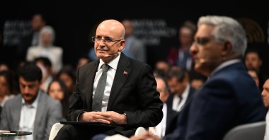 Treasury and Finance Minister Mehmet Şimşek speaks during a panel on the sidelines of the Antalya Diplomacy Forum, Antalya, southern Türkiye, April 11, 2025. (AA Photo)