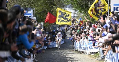 Slovenian rider Tadej Pogacar competes in the Tour of Flanders men&#039;s one-day cycling race, a 268.9 kilometer (167-mile) course from Brugge to Oudenaarde, April 6, 2025. (AFP Photo)