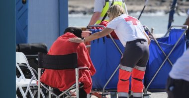 A migrant receives assistance from a Red Cross volunteer in Tenerife, Canary Islands, Spain, April 11, 2025. (EPA Photo)