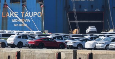 A Volkswagen Group car is loaded into a cargo ship as Porsche luxury and other VW cars intended for export to the United States wait to be loaded at the seaport of Emden near the estuary, where the River Ems flows into the North Sea, in Emden, Germany, April 2, 2025. (Reuters Photo)