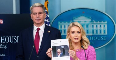 White House Press Secretary Karoline Leavitt (C) holds a photograph of Amazon founder Jeff Bezos with US Treasury Secretary Scott Bessent (L) during a press briefing at the White House, Washington, D.C., April 29, 2025. (EPA Photo)