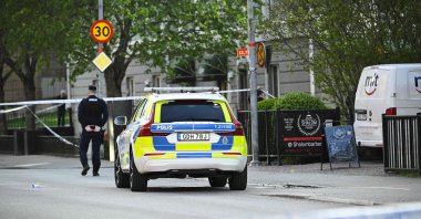 Police officers cordon off the scene after several people were killed in a shooting at Vaksala Square in central Uppsala, Sweden, April 29, 2025. (AFP Photo)
