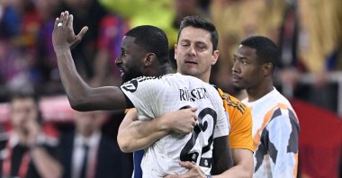 Real Madrid defender Antonio Rudiger is restrained as he shouts at the referee during the Copa del Rey final against Barcelona, Seville, Spain, April 26, 2025. (AA Photo)