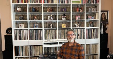 Music producer Naci Keklik poses with his vinyl collection, Istanbul, Türkiye, April 16, 2025. (AA Photo)