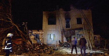 Ukrainian rescuers work at the site of a drone strike on a residential area in Kharkiv, Ukraine, April 29, 2025. (EPA Photo)