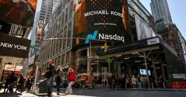 People walk past the Nasdaq MarketSite in Times Square, New York City, U.S., April 9, 2025. (AFP Photo)