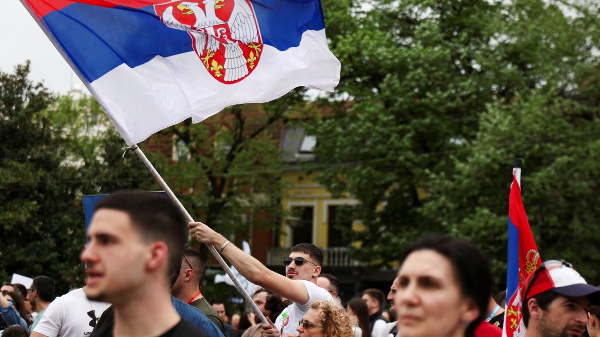 A man waves the Serbian flag during a protest against the government by the Serbian students and their supporters, Kraljevo, Serbia, April 16, 2025. (Reuters Photo)