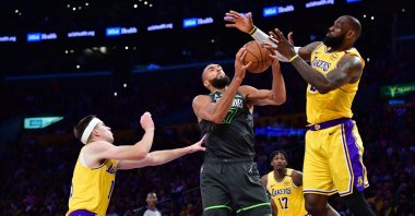 Minnesota Timberwolves center Rudy Gobert (C) gets the rebound against Los Angeles Lakers guard Austin Reaves and forward LeBron James (R) during the second half in Game 5 of the first round for the 2025 NBA Playoffs at Crypto.com Arena, Los Angeles, U.S., April 30, 2025. (Reuters Photo)