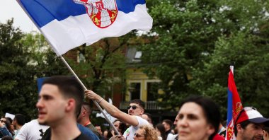 A man waves the Serbian flag during a protest against the government by the Serbian students and their supporters, Kraljevo, Serbia, April 16, 2025. (Reuters Photo)