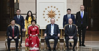 President Recep Tayyip Erdoğan (front 2nd R) takes a souvenir photo with Vietnamese Ambassador Dang Thi Thu Ha (front 2nd L) and her embassy staff and family members at the Presidential Complex, the capital Ankara, Türkiye, May 1, 2025. (AA Photo)