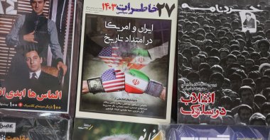 A book with a cover design of the Iran-U.S. negotiations is seen in Tehran, Iran, April 26, 2025. (Reuters Photo)