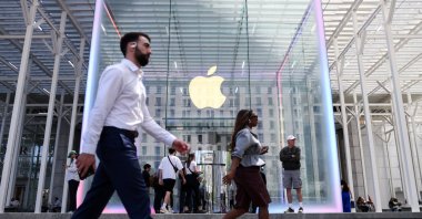 People walk by the Apple store on Fifth Avenue in New York City, U.S., May 1, 2025. (Reuters Photo)