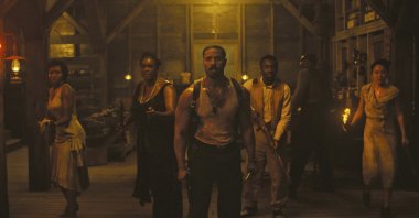 This image released by Warner Bros Pictures shows Michael B. Jordan (C) in a scene from &quot;Sinners.&quot; (AP Photo)