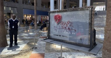 A slab of wall art, &quot;The Battle to Survive a Broken Heart,&quot; created by the artist Banksy, sits on display inside the Brookfield Place atrium, New York, U.S., April 29, 2025. (AP Photo)