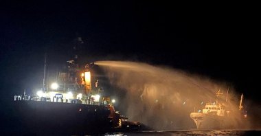 A tug vessel puts out a fire on the Gaza Freedom Flotilla vessel Conscience outside Maltese territorial waters in this handout picture provided by the Malta Government Department of Information, May 2, 2025. (Reuters Photo)