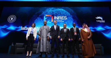 Energy and Natural Resources Minister Alparslan Bayraktar (3rd L) and other speakers pose for a photo following a panel on the sidelines of Istanbul Natural Resources Summit (INRES 2025), Istanbul, Türkiye, May 2, 2025. (AA Photo)