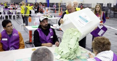 Officials count ballots in the general election at a polling station in Melbourne, Australia, May 3, 2025. (AFP Photo)