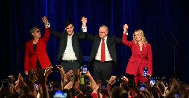 Australia&amp;#039;s Prime Minister Anthony Albanese celebrates with his partner Jodie Haydon (R), son Nathan Albanese and Australia&amp;#039;s Foreign Minister Penny Wong (L) after winning the general election at the Labor Party election night event in Sydney on May 3, 2025. (AFP Photo)
