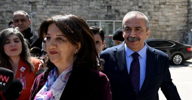 People’s Equality and Democracy Party (DEM Party) lawmakers Sırrı Süreyya Önder (R) and Pervin Buldan (L) talk to reporterS ahead of a meeting with President Recep Tayyip Erdoğan, Ankara, Türkiye, April 10, 2025. (AA Photo)