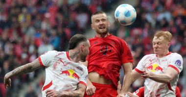 Munich&#039;s Eric Dier (C) goes for a header to score the 2-1 goal during the German Bundesliga match between RB Leipzig and Bayern Munich, Leipzig, Germany, May 3, 2025. (EPA Photo)