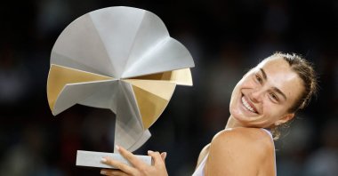 Belarus&#039; Aryna Sabalenka poses with her trophy after winning against the U.S.&#039; Coco Gauff during their 2025 WTA Tour Madrid Open tennis tournament singles final match at the Caja Magica, Madrid, Spain, May 1, 2025. (AFP Photo)